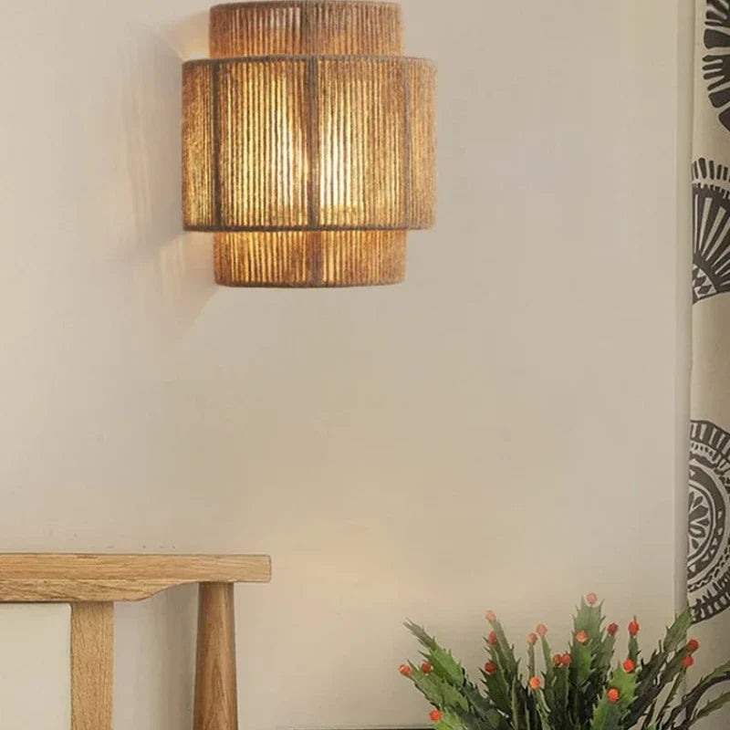 Traditional bohemian wicker wall sconce for dining room lighting.