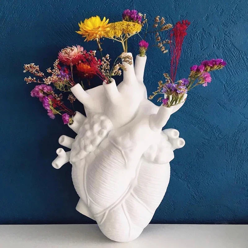 Modern heart sculpture vase for living room décor.