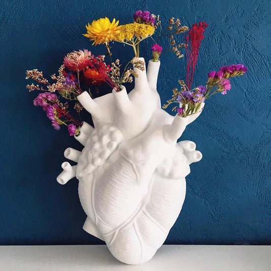 Modern heart sculpture vase for living room décor.