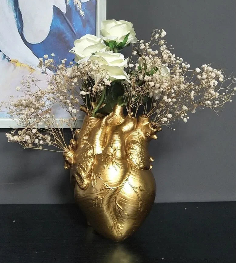 Elegant resin flower pot with anatomical design.