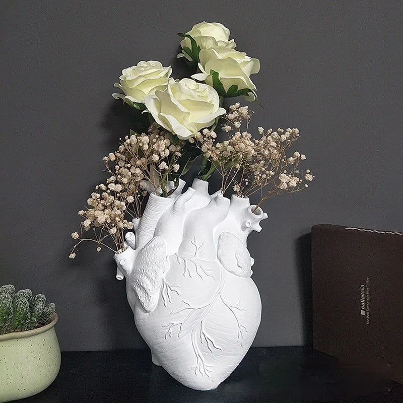 Contemporary resin heart vase centerpiece.