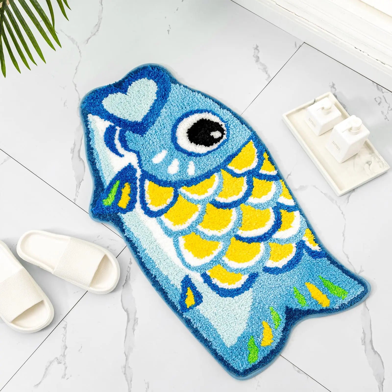 Blue koi fish washable bath mat on white tile bathroom floor