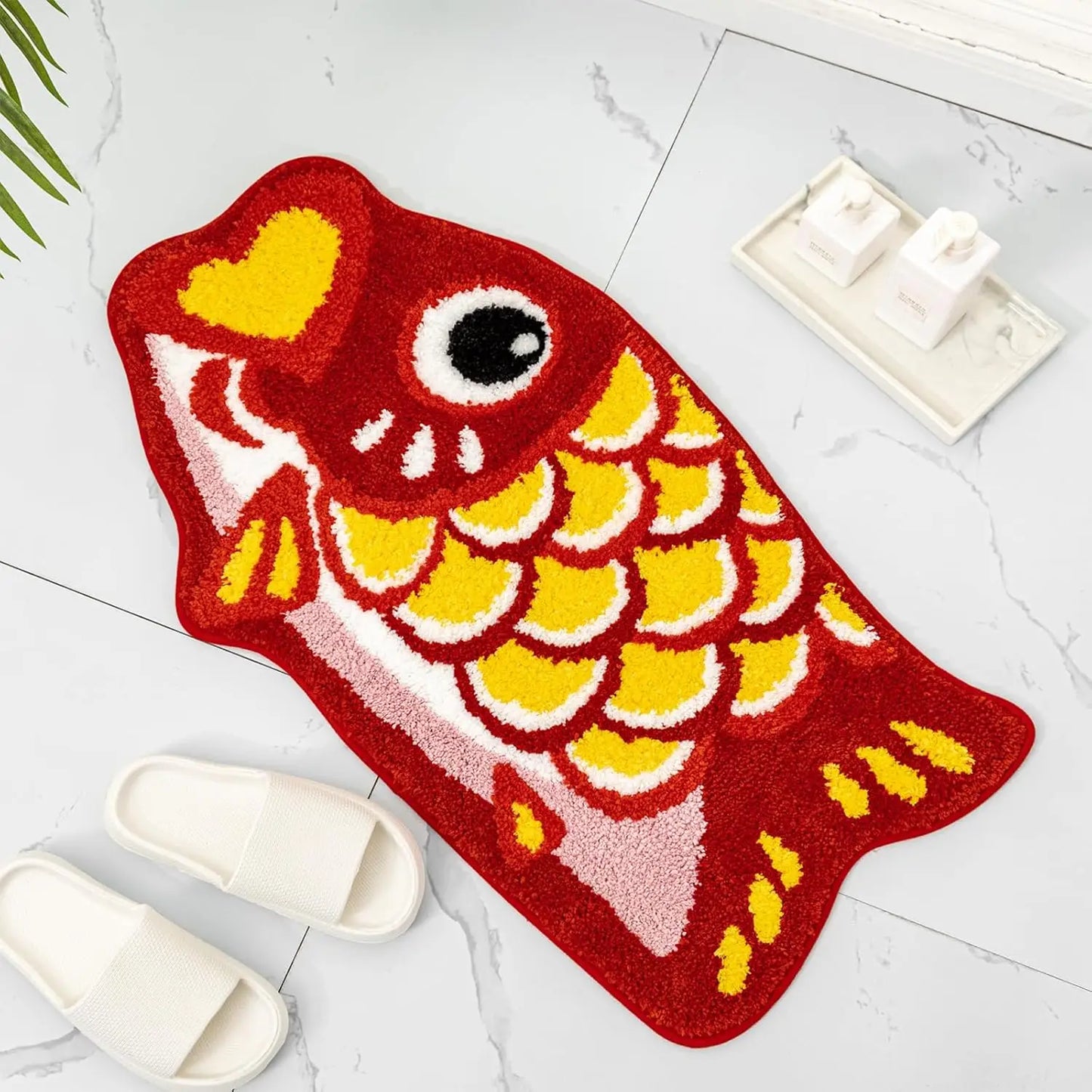 Red and yellow cartoon fish bath mat