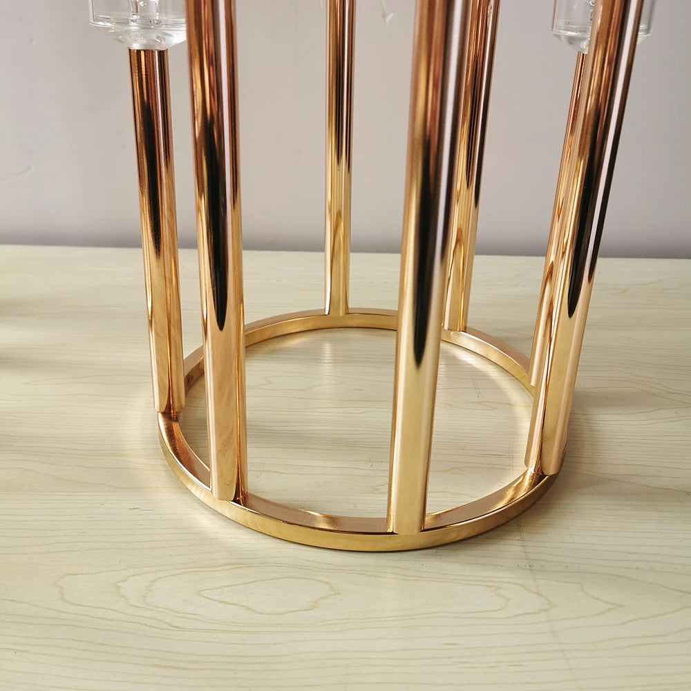Elegant gold iron candle holder for wedding and event table styling.