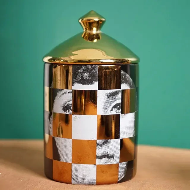 Artistic mosaic gold candle holder with portrait design.