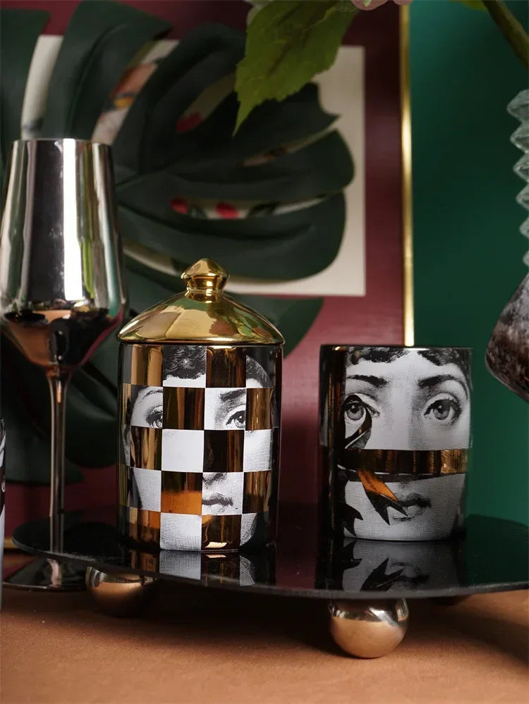 Artistic collectible candle cup with gold pattern.