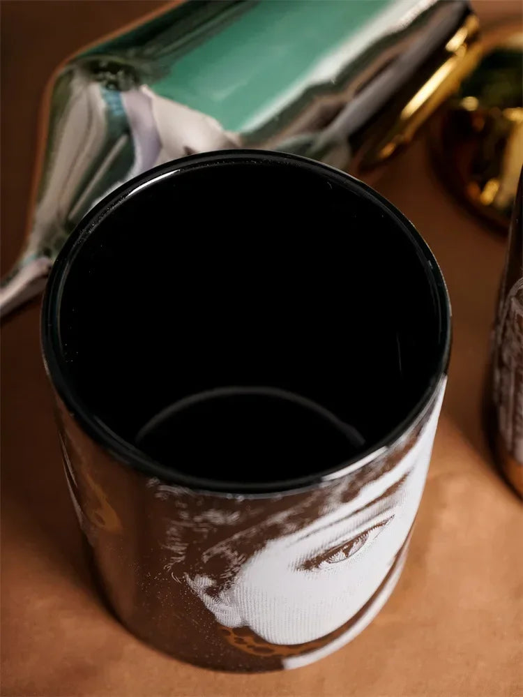 Golden portrait decorative jar for luxury interiors.