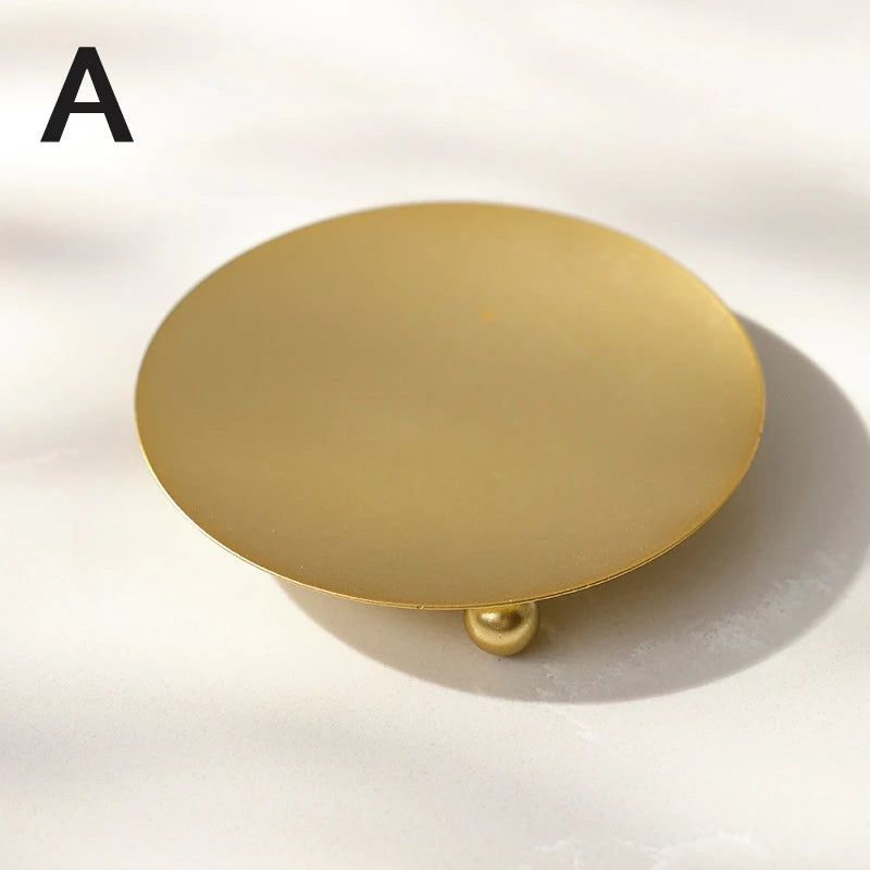 Elegant gold candle stand for festive celebrations.