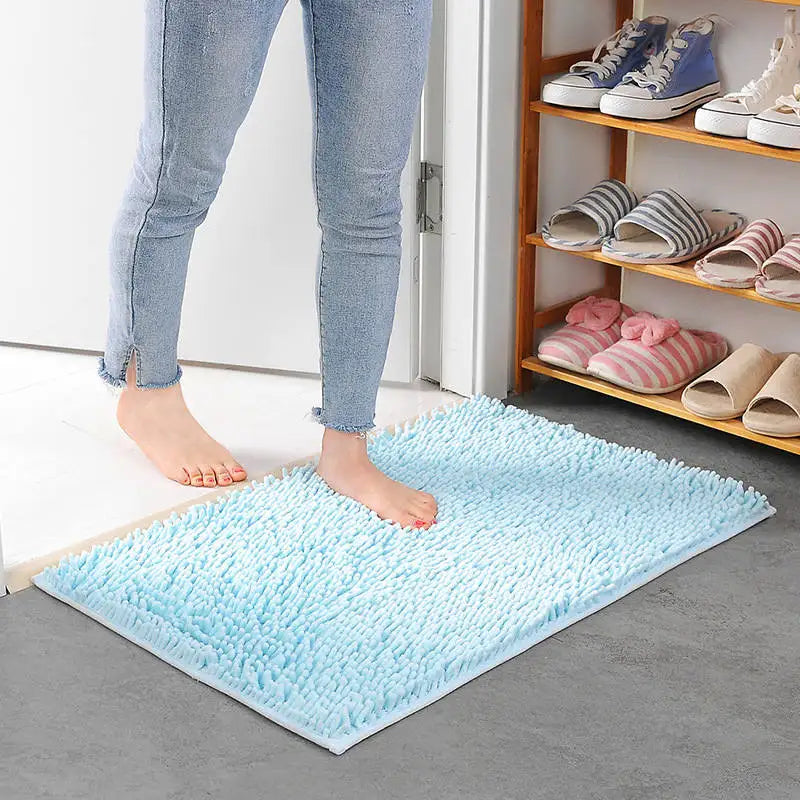 Sky blue absorbent non-slip bathroom mat with soft memory foam.