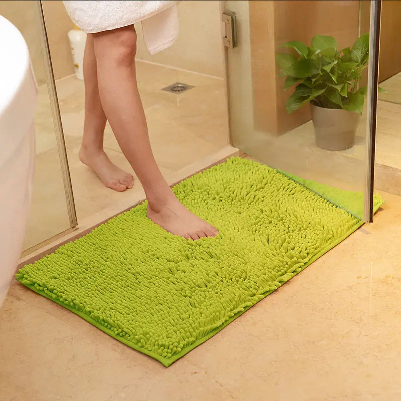 Grass green plush EVA bath mat for shower and toilet area.