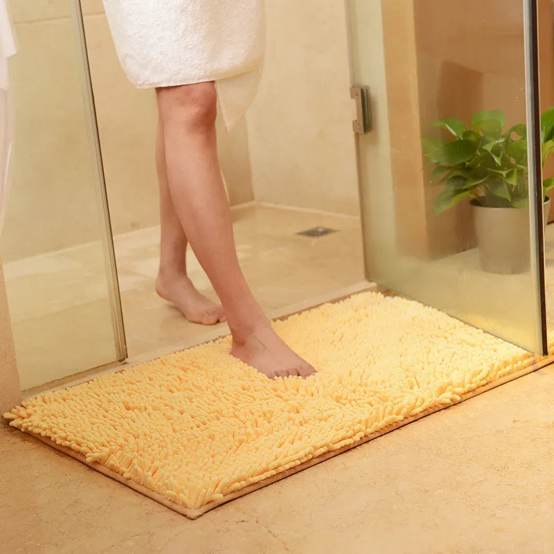 Yellow quick-dry memory foam rug for bathtub area.