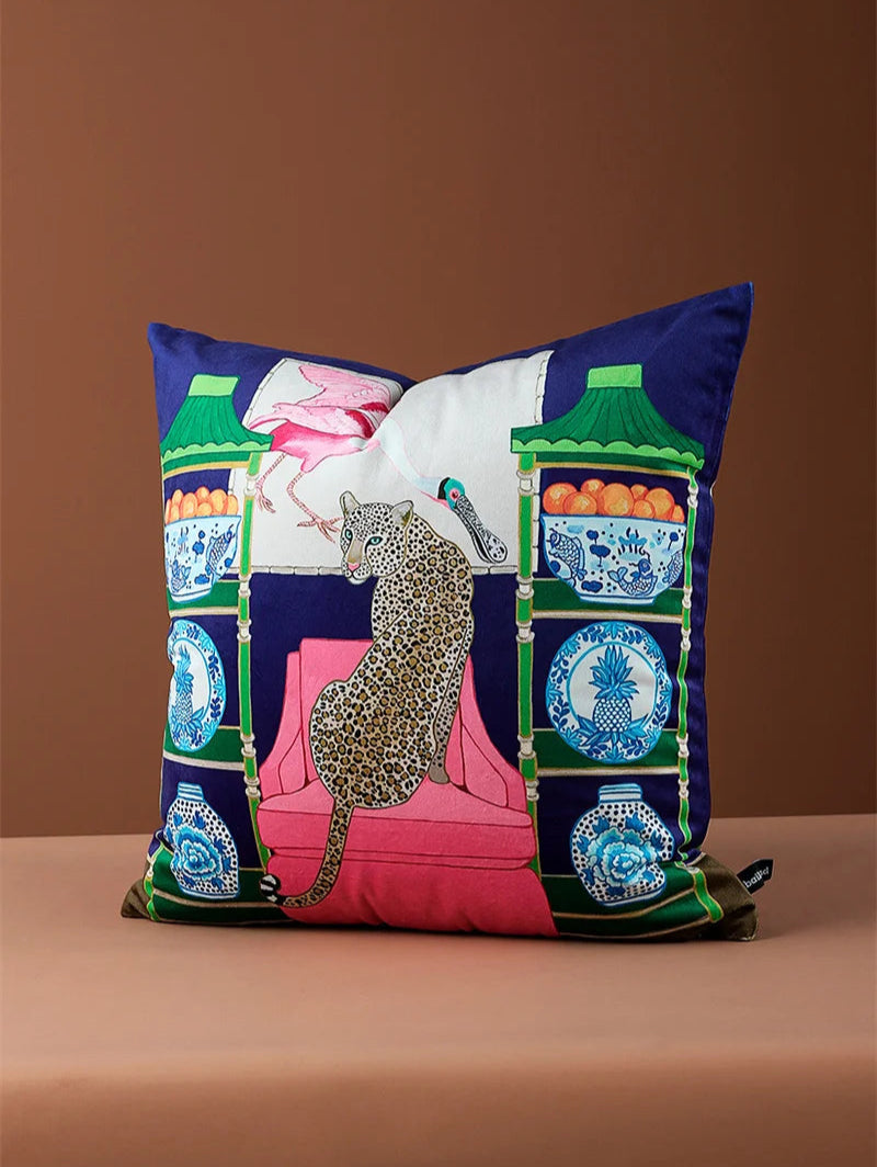 Decorative velvet cushion featuring jungle-inspired artwork.