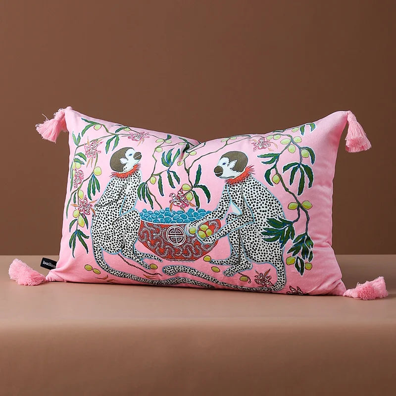 Double-sided printed velvet cushion with tassels.