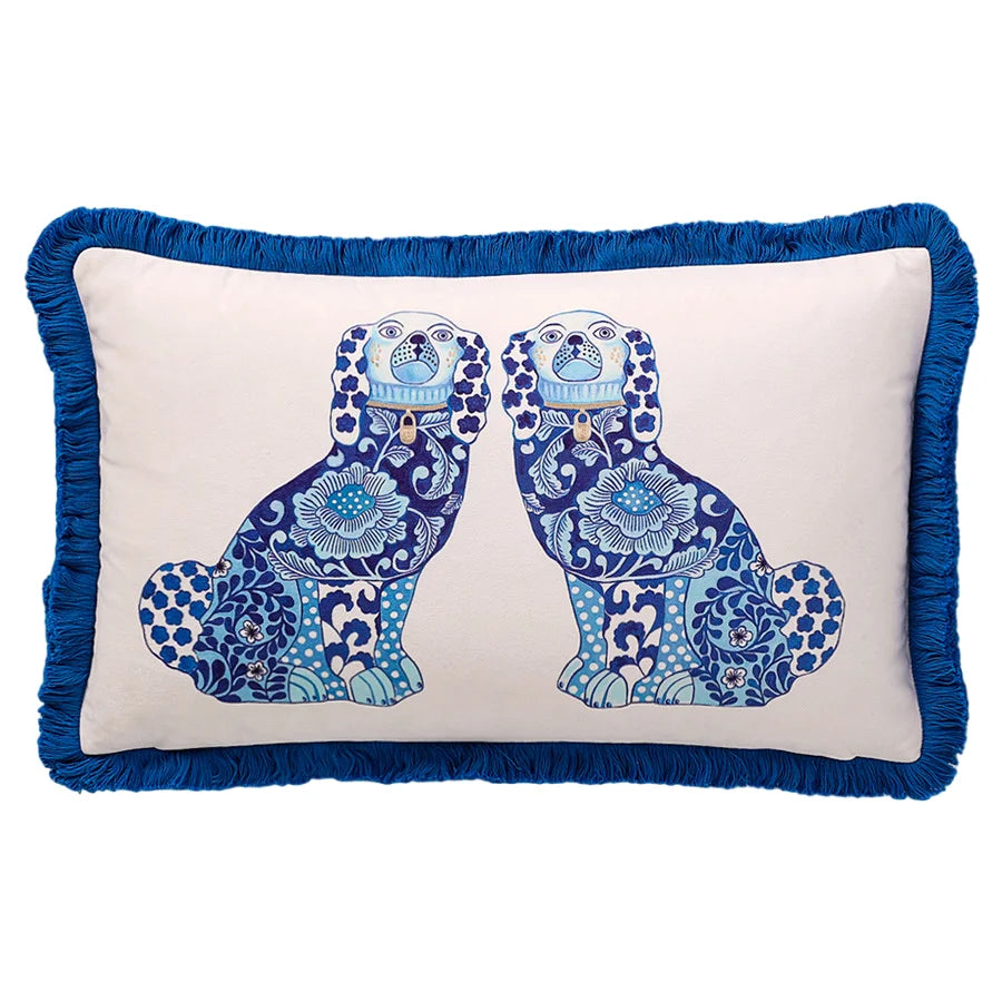 Blue twin dog velvet pillow with tassel corners.