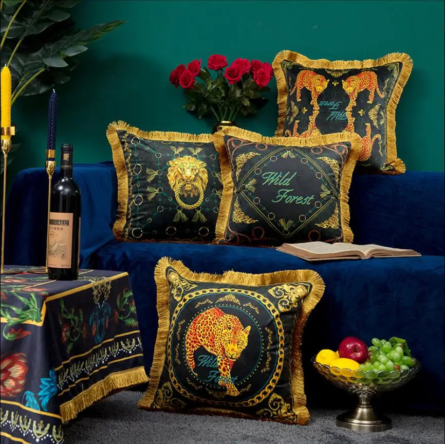 Elegant velvet sofa pillow with golden lion print and tassel edge.