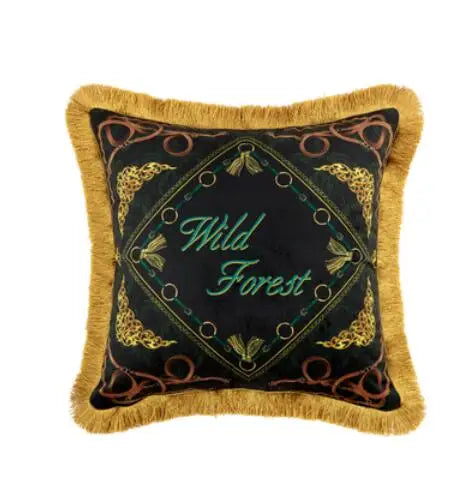 Decorative square cushion with Wild Forest embroidery and gold trim.