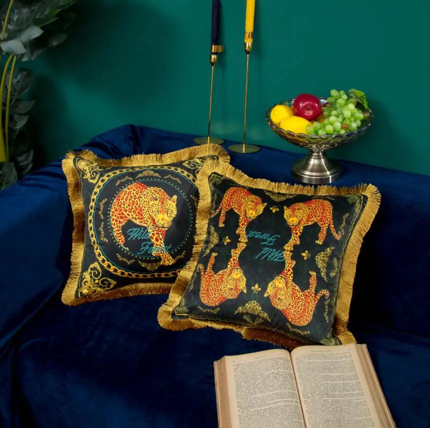 Gold and black velvet pillow with elegant animal motif.