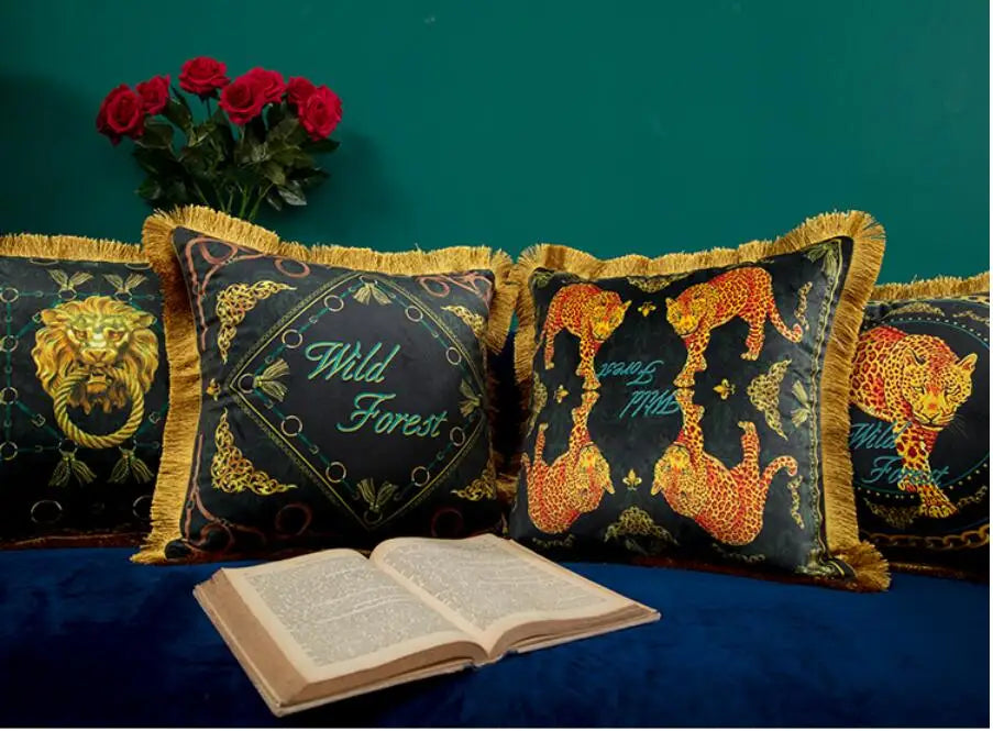 Premium velvet sofa pillow with golden tassel finish.