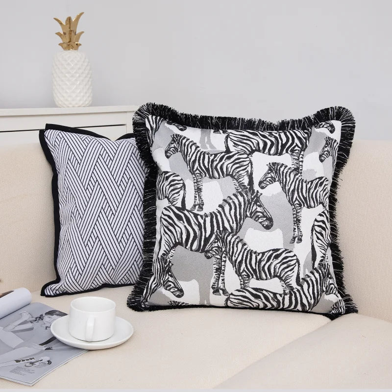 Black and white zebra print cushion cover on modern sofa.
