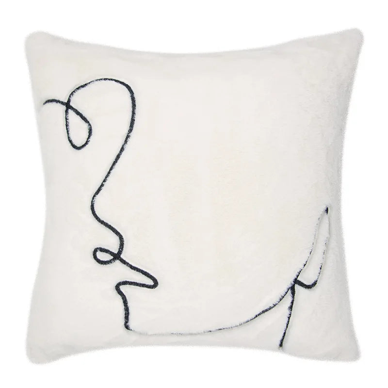 Knitted zebra-inspired cushion cover for stylish interiors.