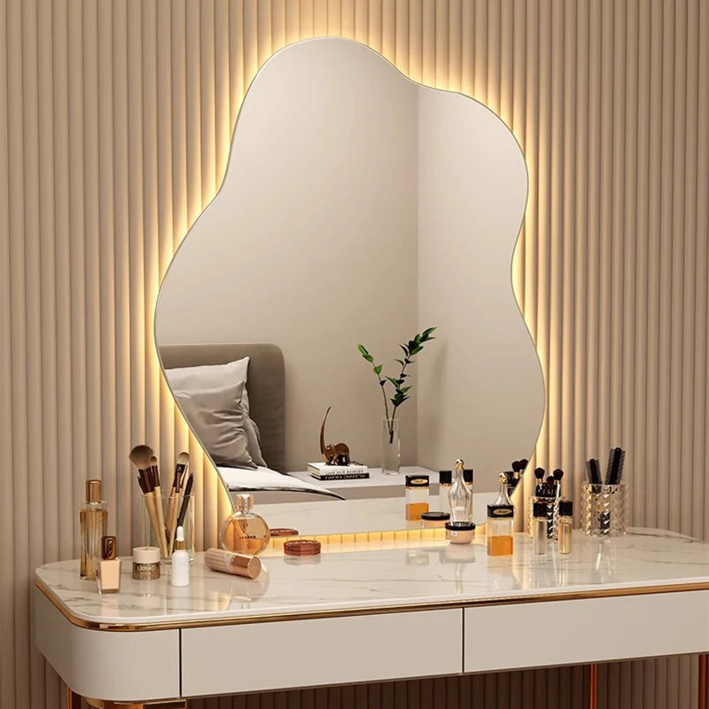 Aesthetic large wave mirror with warm white LED lighting.