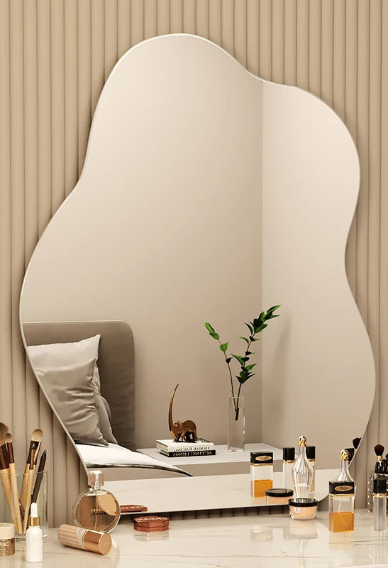 Minimalist aesthetic mirror with sculptural wave edges.