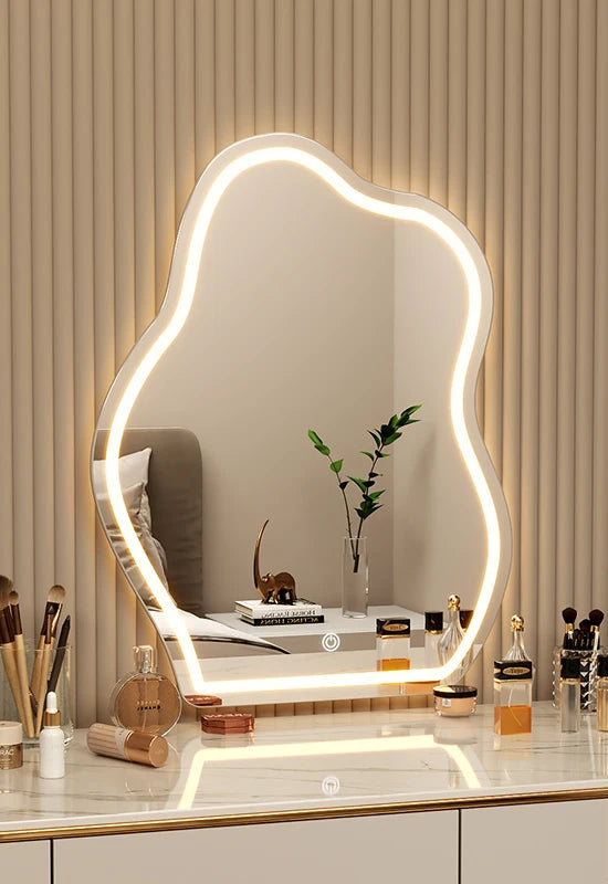 Large irregular wall mirror with ambient LED glow.