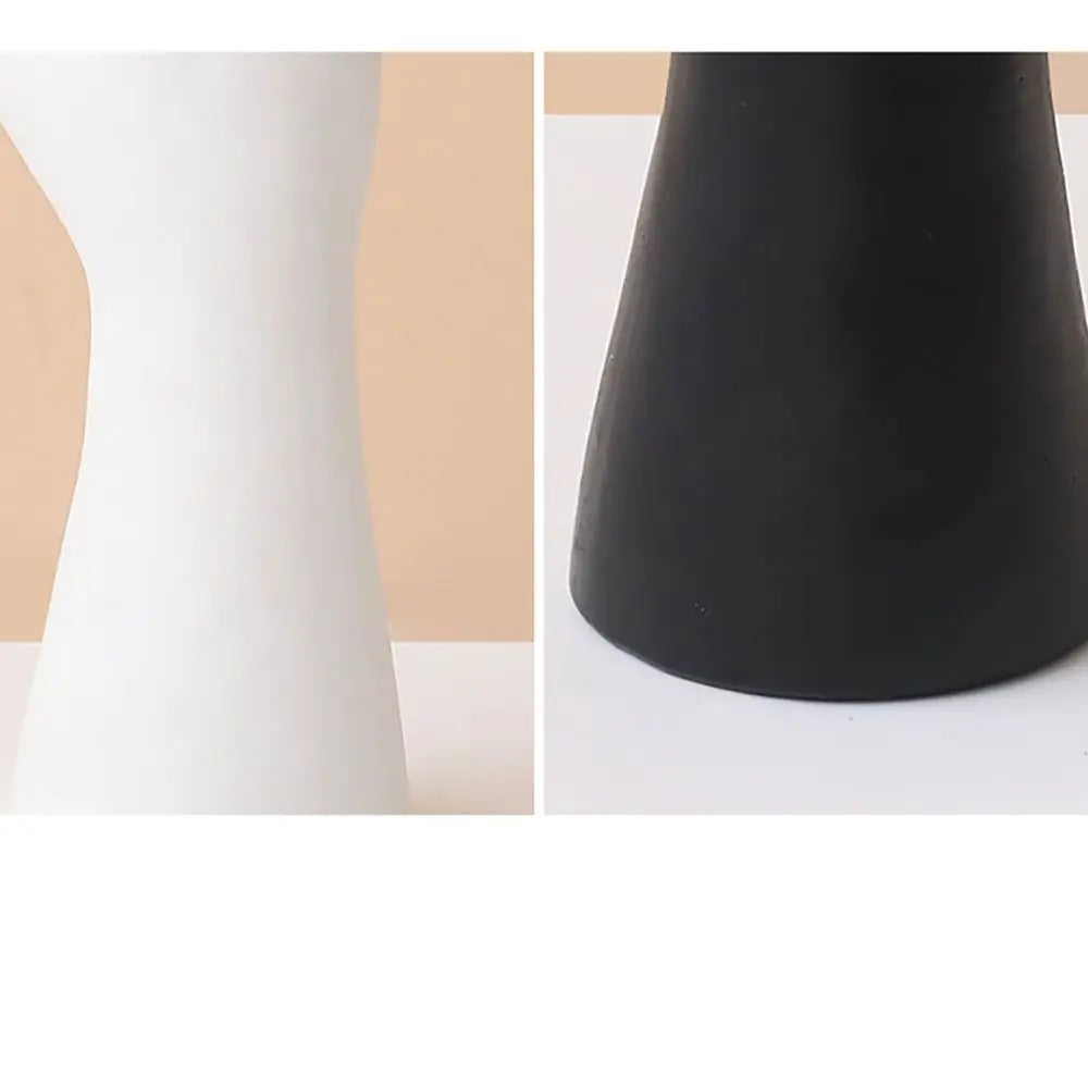 White hand-shaped flower vase for modern interiors.