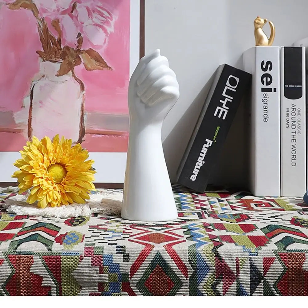 Minimalist resin hand vase for office and home decoration.