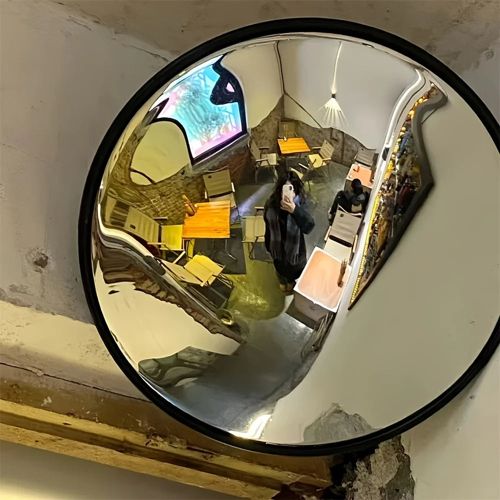 Minimalist round mirror with black frame for modern décor.