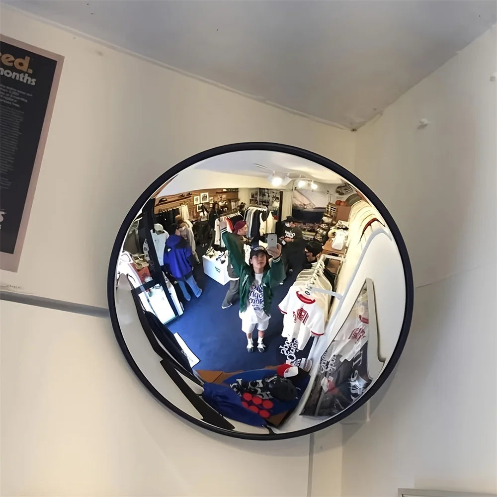 Decorative round mirror with elegant reflective glass.