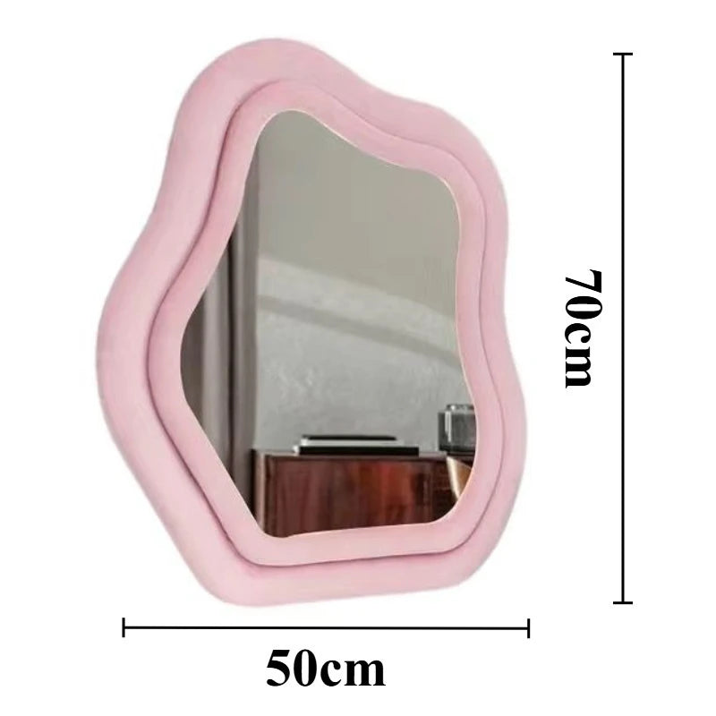 Modern wavy frame mirror in pink for living room décor.