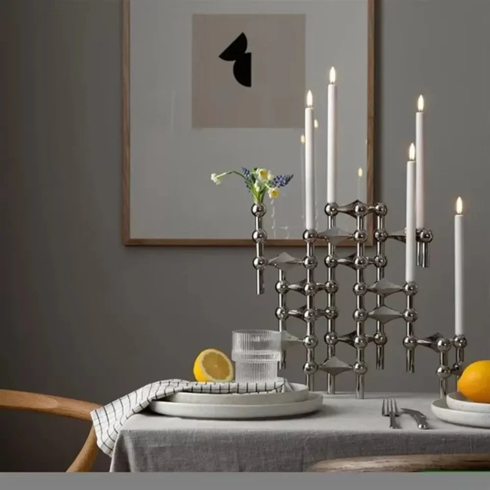 Stainless steel chrome-plated candlestick stand for modern décor.
