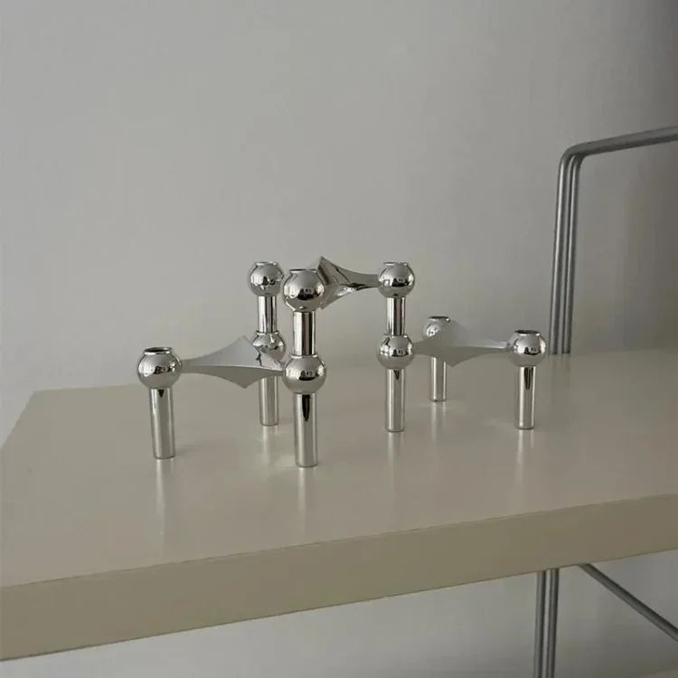 Silver modular candle holder for chic living room décor.