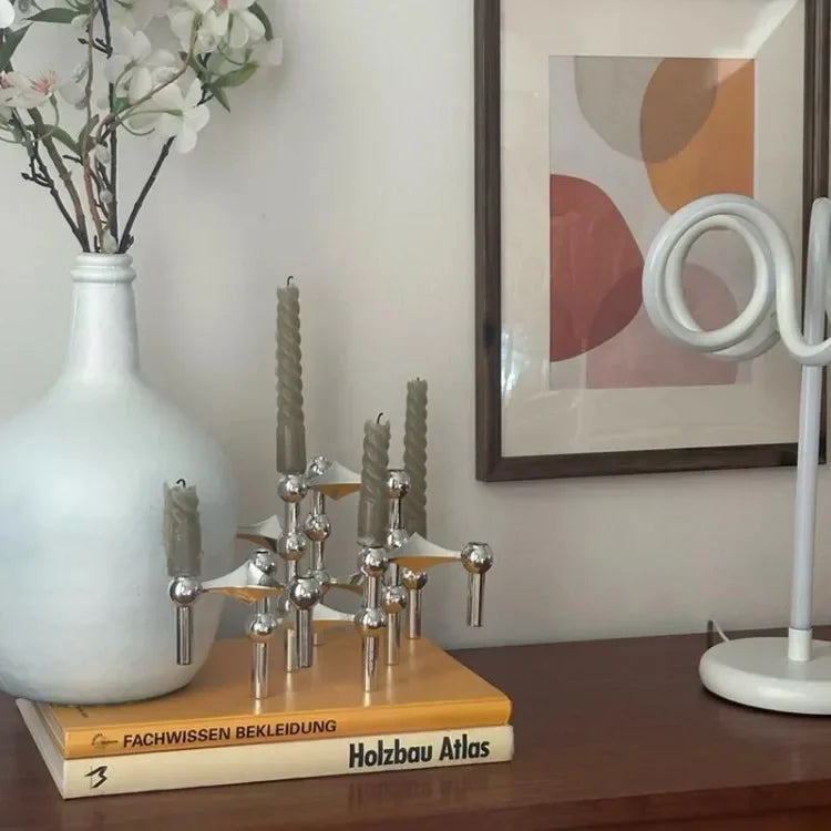 Modern silver candlestick holder for contemporary weddings.