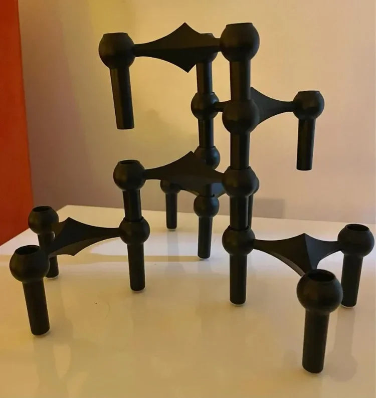 Modern black candle holder for stylish interiors.