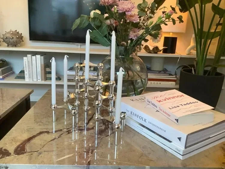 Unique modular silver candle holder for holiday decoration.