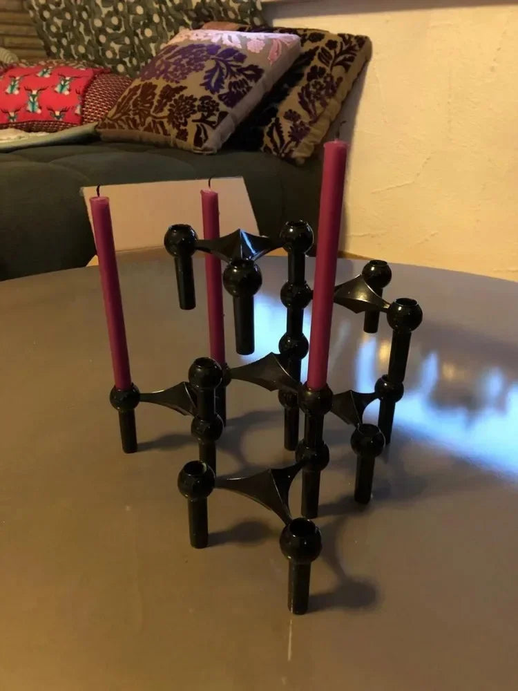 Stackable black candlestick stand for slim stick candles.