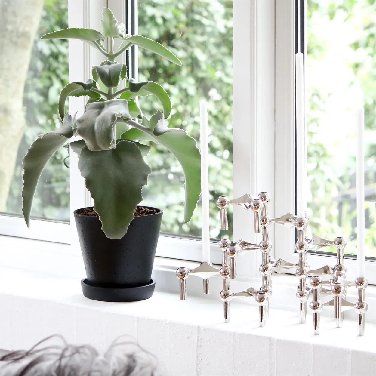 Decorative chrome candle holder for luxury interiors.