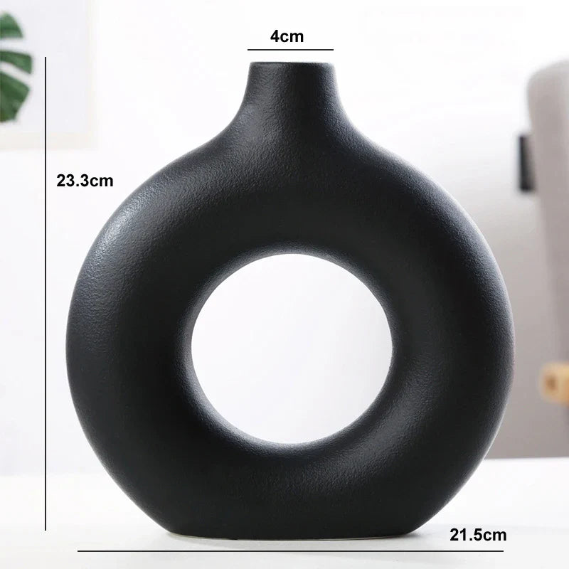 Decorative donut ceramic vase for countertop display.