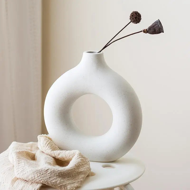 Contemporary donut vase for stylish interior decoration.