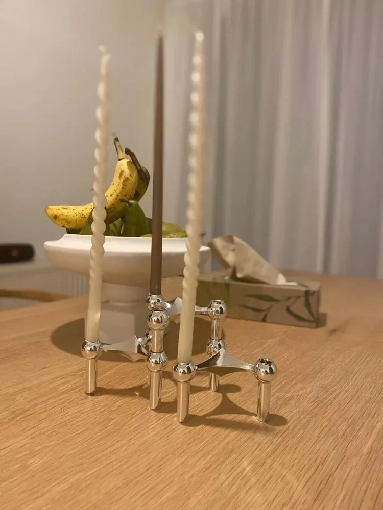 Luxury geometric gold molecular candlestick for stylish interiors.