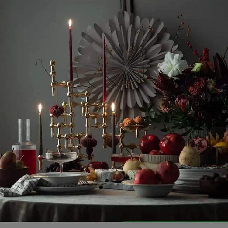 Nordic-inspired gold candlestick sculpture for luxury interiors.