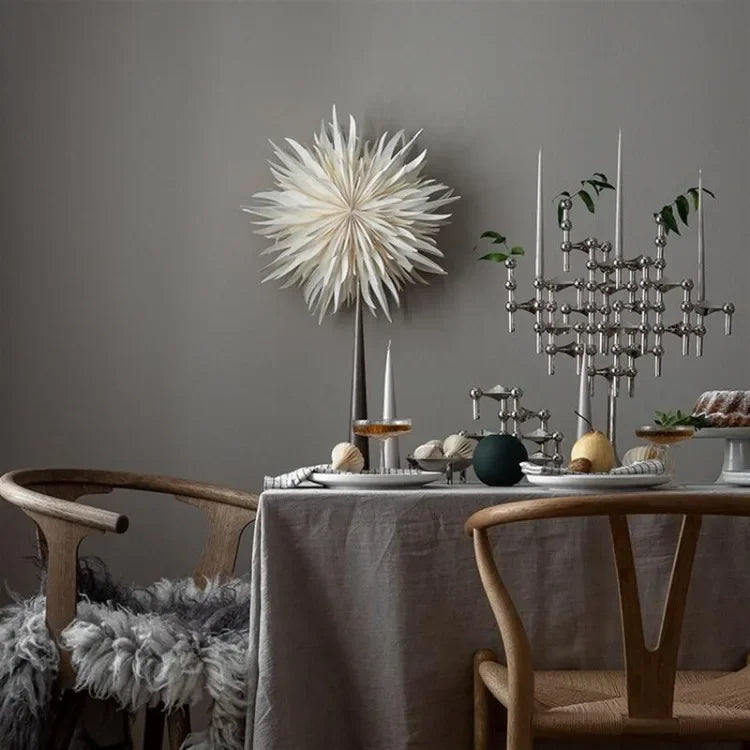 Stackable modular silver candle stand for creative table arrangements.