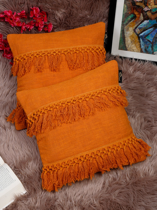 Orange self-design pure cotton pillow covers with fringe pattern.