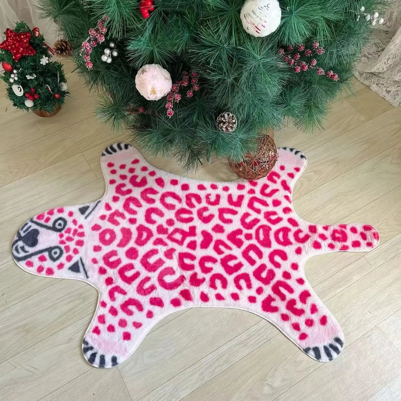 Washable faux animal skin rug in pink for bedrooms.