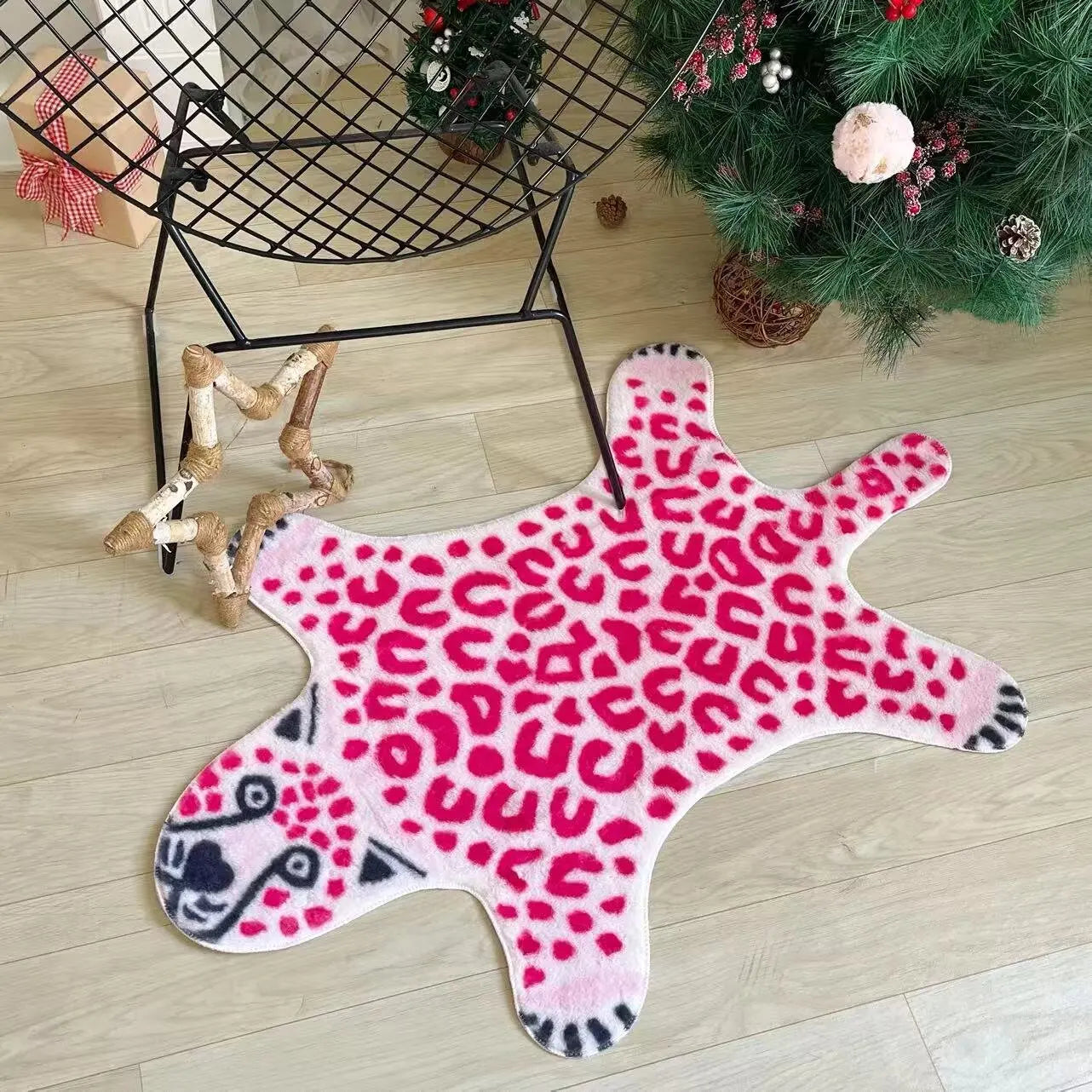 Modern pink faux skin rug with bold leopard design.