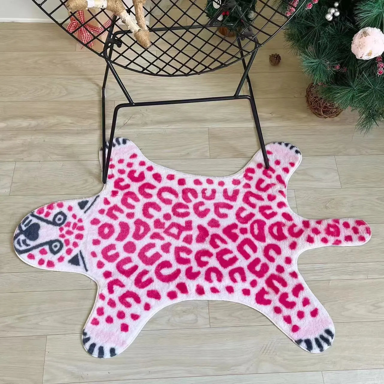Decorative pink leopard rug for living rooms and playrooms.