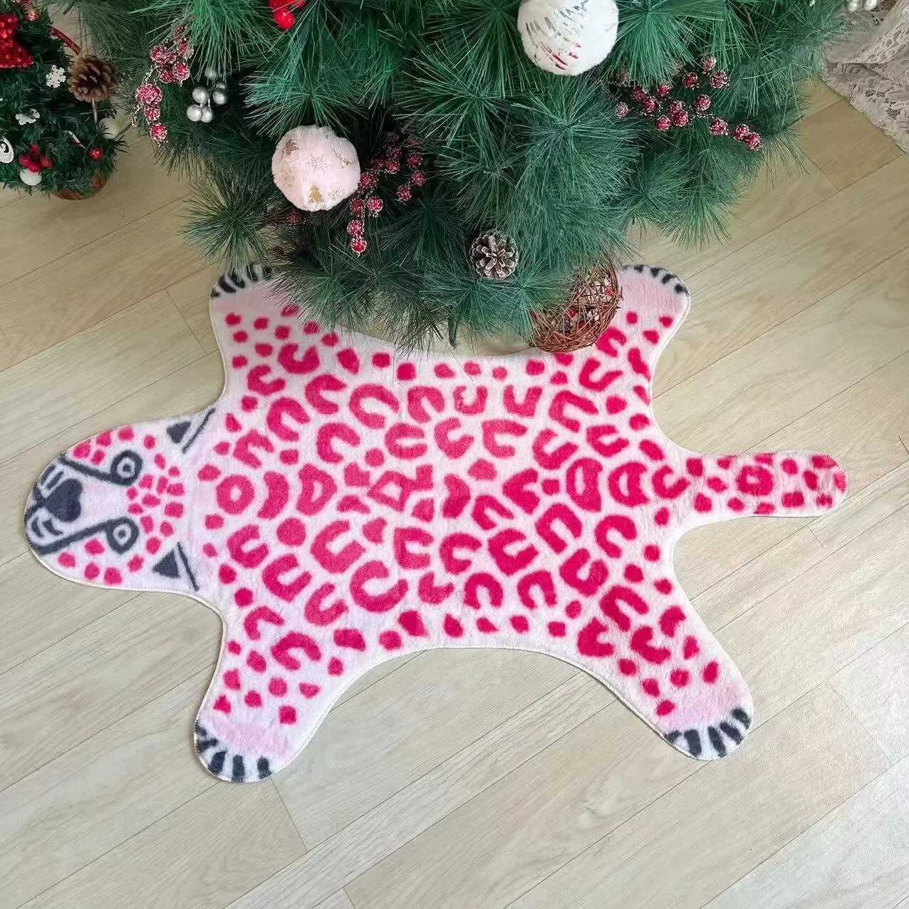 Washable pink animal print rug with foldable design.