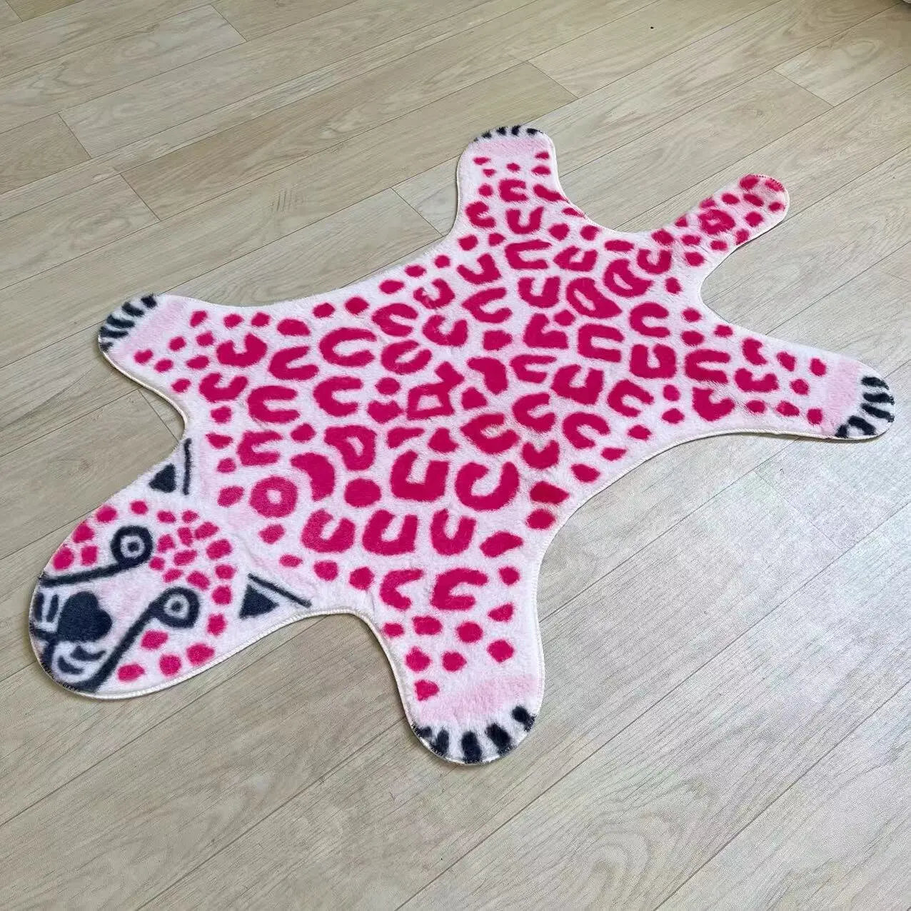 Quirky pink leopard carpet for dorms and small spaces.